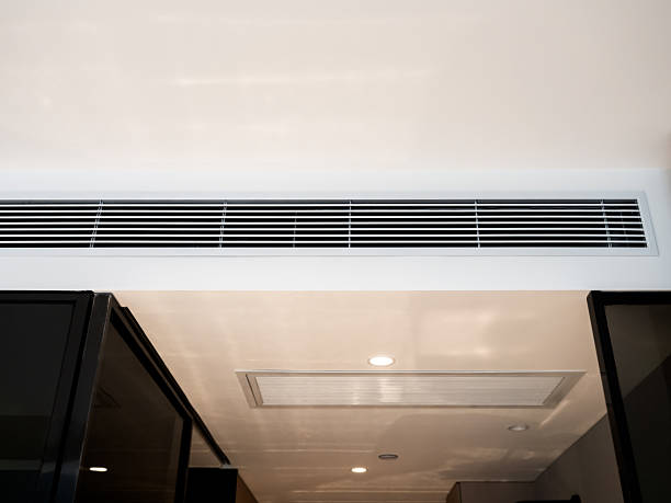 istock Wall-mounted air vent system inside a white clean modern hotel room, showing HVAC ductwork for indoor air circulation, cooling system design, and energy-efficient building ventilation. 2253062895