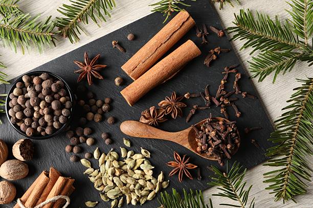 istock Different spices and fir branches on wooden table, flat lay 2253062987