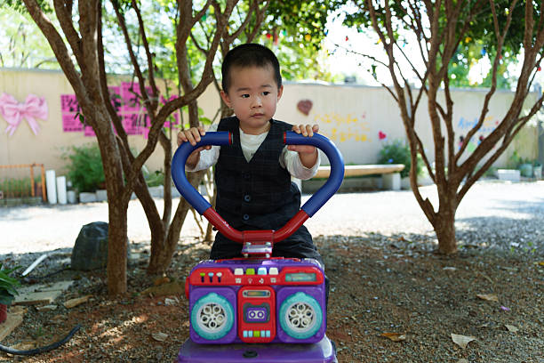 Close up of children's hands playing with car
