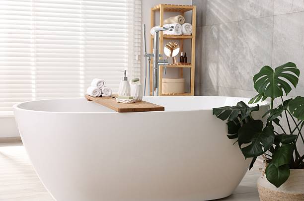 istock Different personal care products on bath tub in bathroom 2253063935