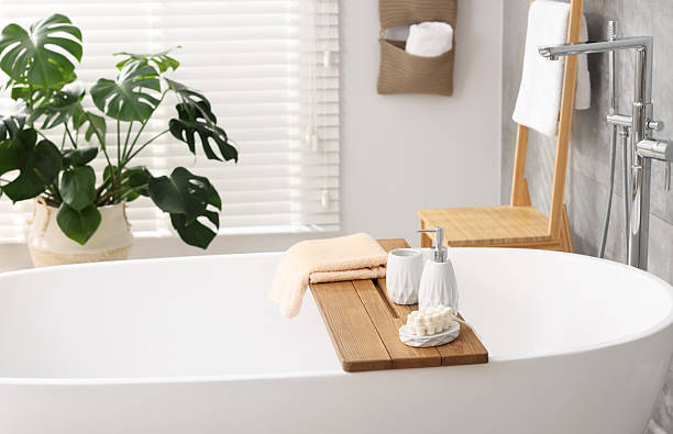 istock Set of different bath accessories and soap on tub in bathroom 2253063936