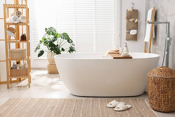 istock Set of different bath accessories and soap on tub in bathroom 2253064091