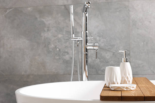 istock Set of bath accessories on tub in bathroom, space for text 2253064610