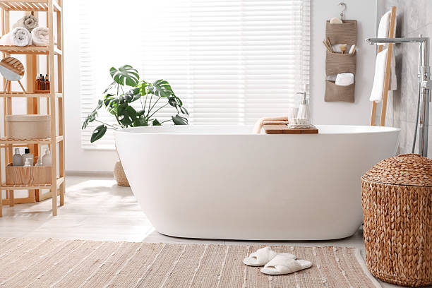 istock Set of different bath accessories and soap on tub in bathroom 2253064689