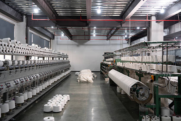istock Textile factory with yarn and machines 2253065750