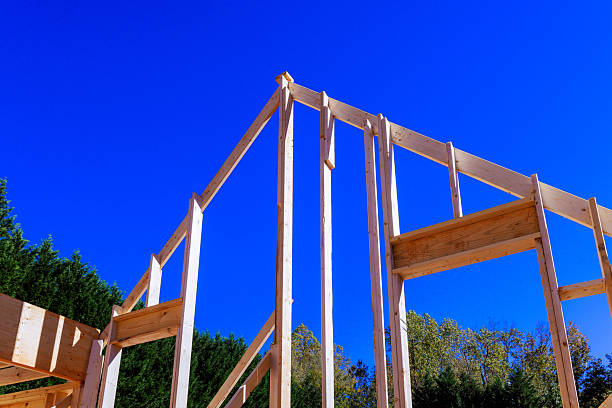 istock Construction of wooden beams frame for new building 2253067808