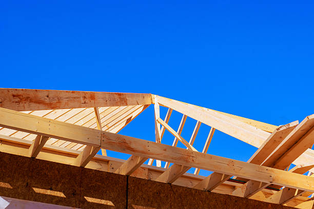 istock Wooden roof frame construction under beams joist studs in building project 2253067891