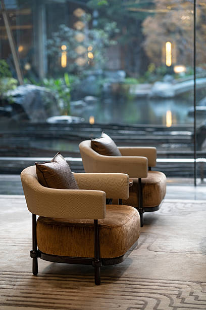 istock Cozy armchairs in elegant lounge 2253069584
