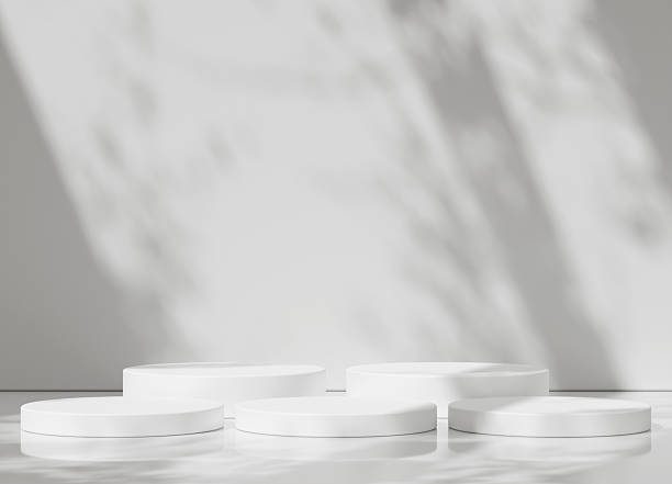 istock A pair of white podium stands with soft natural shadows on a white background, emphasizing simplicity. 2253070327