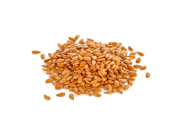 istock Golden flax seeds on a white background 2253072250