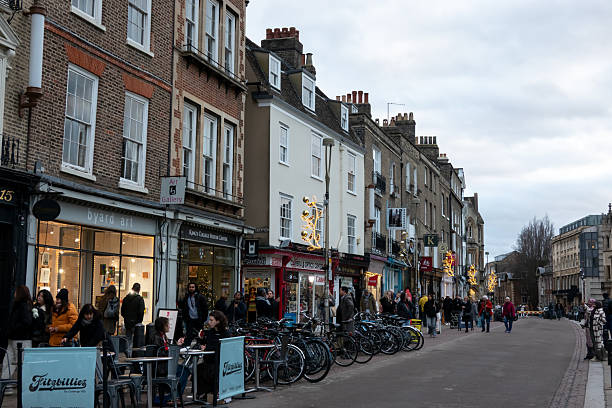 Cambridge, UK - November 28, 2025: Kings Parade, Cambridge with outdoor dining and bicycles in winter