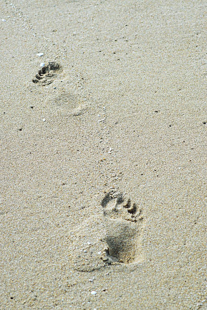 istock Foot print on the beach, Summer time 2253074142