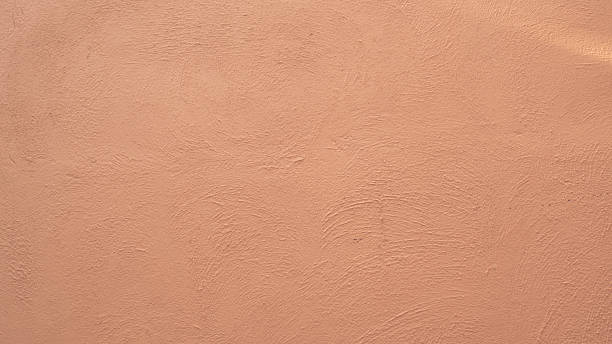 istock A Detailed View of a Textured Peach Stucco Wall Surface 2253075075