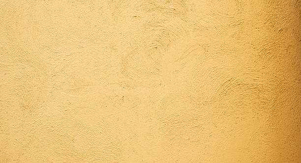 istock Sunlit Abstract Stucco Concrete Wall, Artful Interplay of Light and Shadow 2253075076