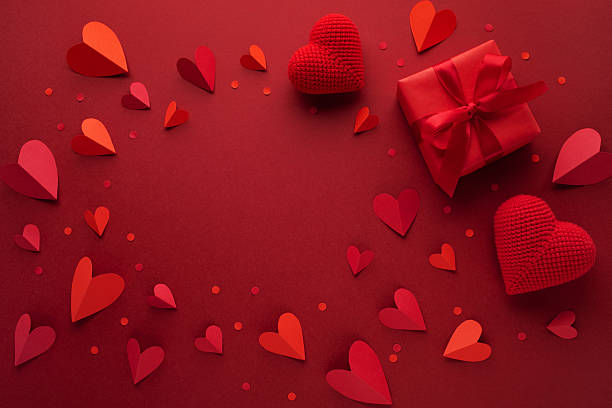istock Valentine day romantic frame background with craft red hearts and gift box top view. 2253077333