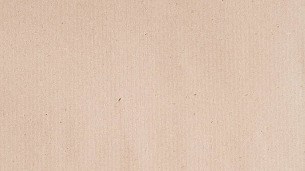 istock Light beige paper texture background with subtle fibers and natural vertical grain, ideal for design projects and mockup use. Natural paper simplicity, paper minimalism, paper background, copy space 2253078390