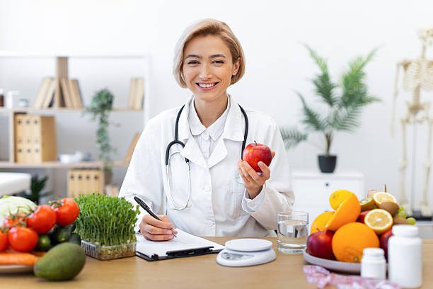 istock Nutritionist with Apple and Fruits 2253086000