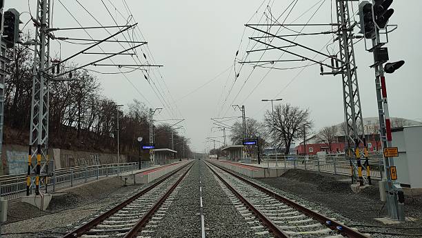 istock A pair of tracks at empty railway station 2253086438