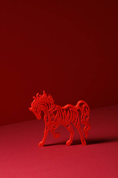 Red horse silhouette on red background for Lunar New Year.