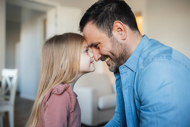 istock Affectionate father touching noses with his young daughter 2253086854