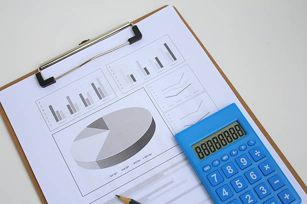 Paperwork and result report for Business improvement concept. Soft focus. Working paper with documentation, pen and charts. Business, Finance, Audit and Budget improvement concept for organisation. Symbol and design for presentation and reporting  background. Quality Management System inspection report.