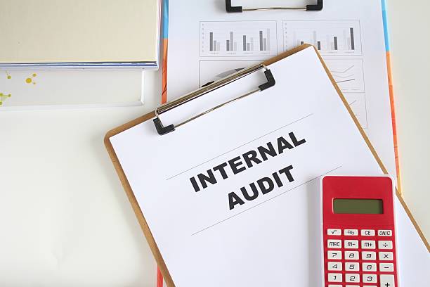 istock Internal Audit text on working paper with pen and calculator. 2253087516