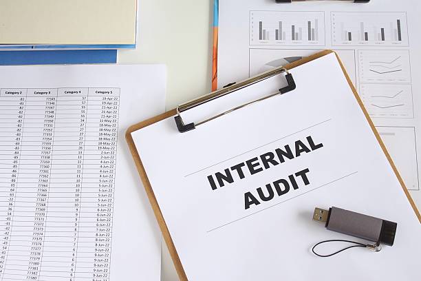 istock Internal Audit text on working paper with pen and calculator. 2253087520