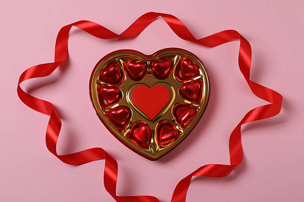 istock Valentine's Day banner with gift boxes surrounded by red hearts on a pink background. Perfect for romantic and festive events. 2253089670