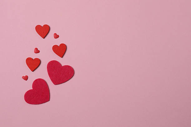 istock Valentine's Day banner with gift boxes surrounded by red hearts on a pink background. Perfect for romantic and festive events. 2253089791