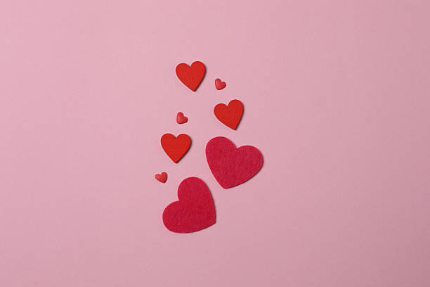 istock Valentine's Day banner with gift boxes surrounded by red hearts on a pink background. Perfect for romantic and festive events. 2253089792