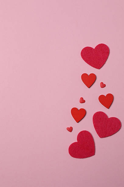 istock Valentine's Day banner with gift boxes surrounded by red hearts on a pink background. Perfect for romantic and festive events. 2253089808