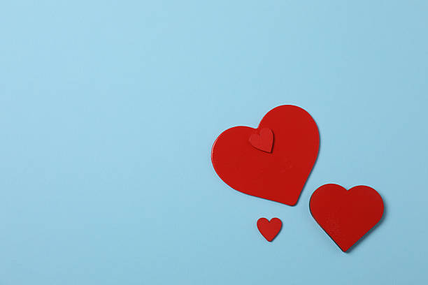istock Valentine's Day banner with gift boxes surrounded by red hearts on a blue background. Perfect for romantic and festive events. 2253090653