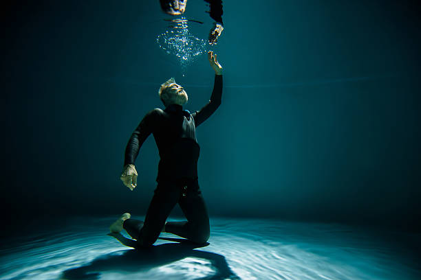 istock Senior free diver training breath hold underwater 2253091153
