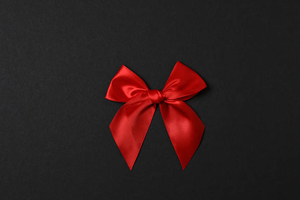 istock A bright bow with a red ribbon on a colored background 2253092007