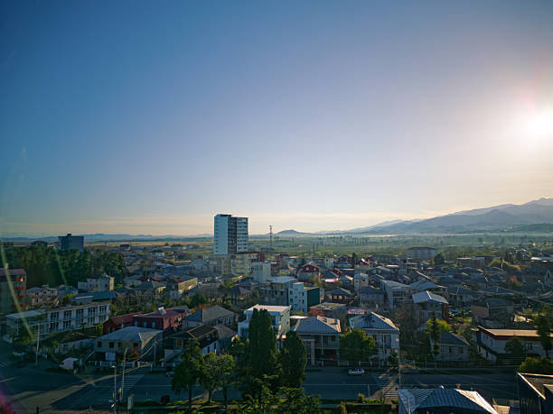 istock Dense Residential Neighborhood Rooftops Illuminated by Golden Sunset Light 2253095900