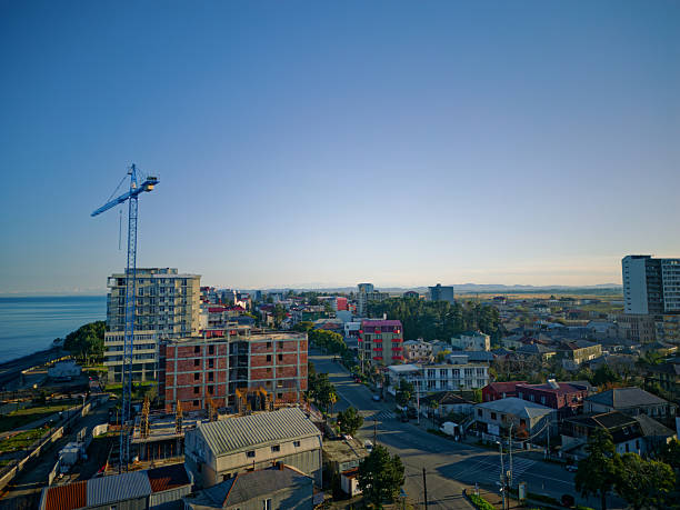 Batumi, Arjara, Georgia, Saqartvelo - Dense Residential Neighborhood Rooftops Illuminated by Golden Sunset Light