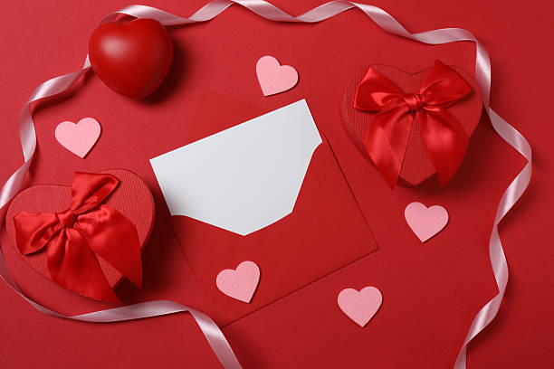 istock Valentine's Day banner with gift boxes surrounded by red hearts on a red background. Perfect for romantic and festive events. 2253096793