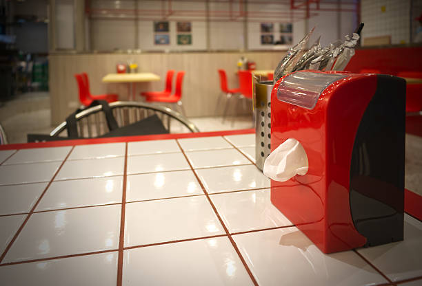 Red tissue box on table and interior restaurant in shopping mall at Sukhumvit Road, Pathumwan, Bangkok, Thailand