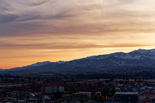 istock Panoramic of the snow-capped Caucasus Mountains at sunset 2253099246