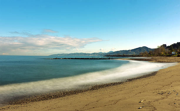 istock Calm Sandy Beach with Smooth Sea and Clear Horizon 2253101476