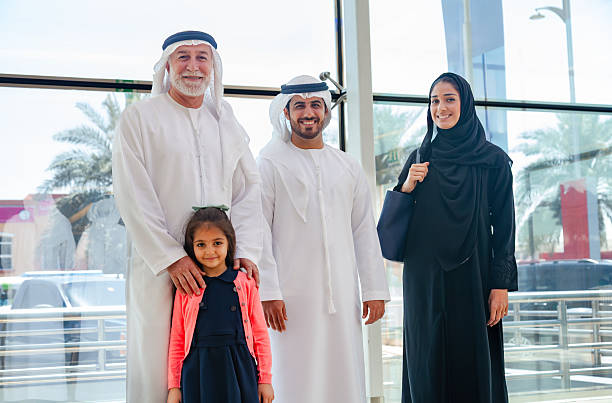 istock Happy Three Generation Middle Eastern Family Portrait in Modern Public Building Interior 2253106423
