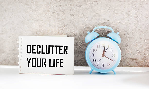 istock A notebook with the words DECLUTTER YOUR LIFE on a light background. business concept. 2253106705