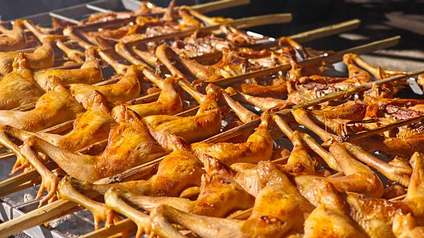istock Thai grilled chicken on a rotisserie. 2253109067