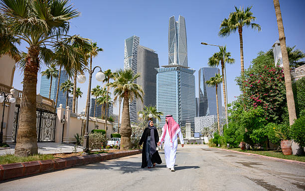istock Saudi couple walking in Riyadh financial district 2253109727