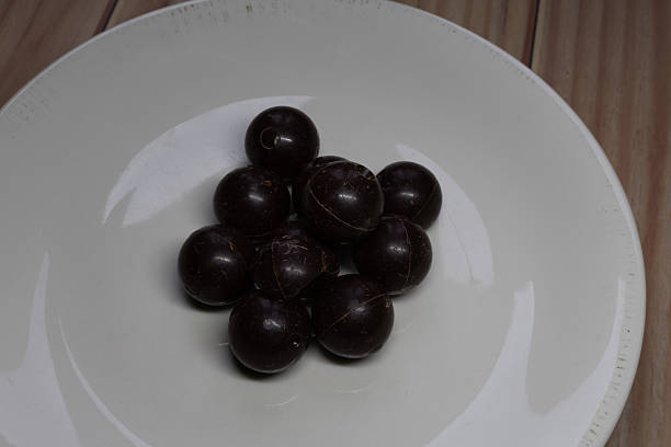 Marzipan spheres covered with chocolate close up