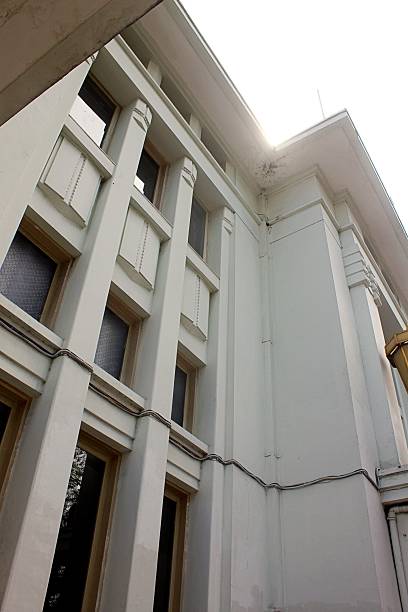 istock Historical Building Facade with Tall Columns and Decorative Windows in Daylight 2253110872