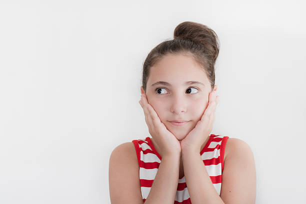 Cute little girl thinking on white background