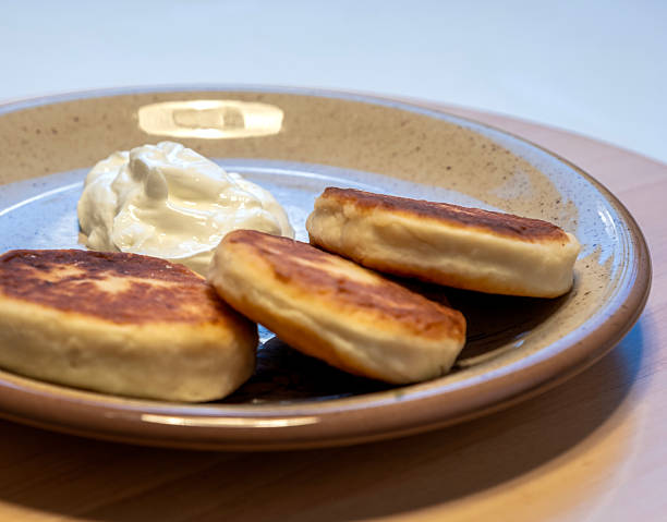 istock Cottage cheese pancakes with sour cream 2253112074