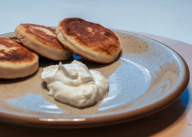 istock Cottage cheese pancakes with sour cream 2253112128
