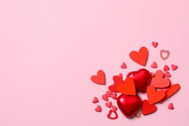 istock Red hearts on pink background 2253112199